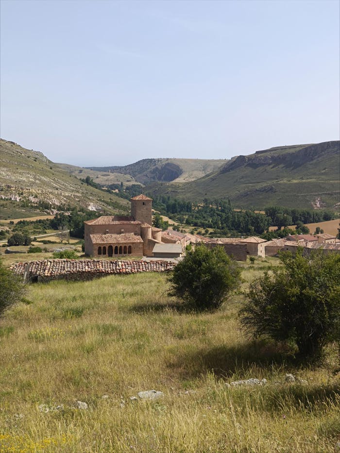 Explore a stunning view of a medieval village nestled in Sorias mountainous landscape.
